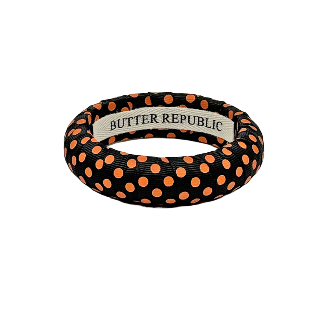 Butter Republic black medium bangle bracelet with orange polka dots