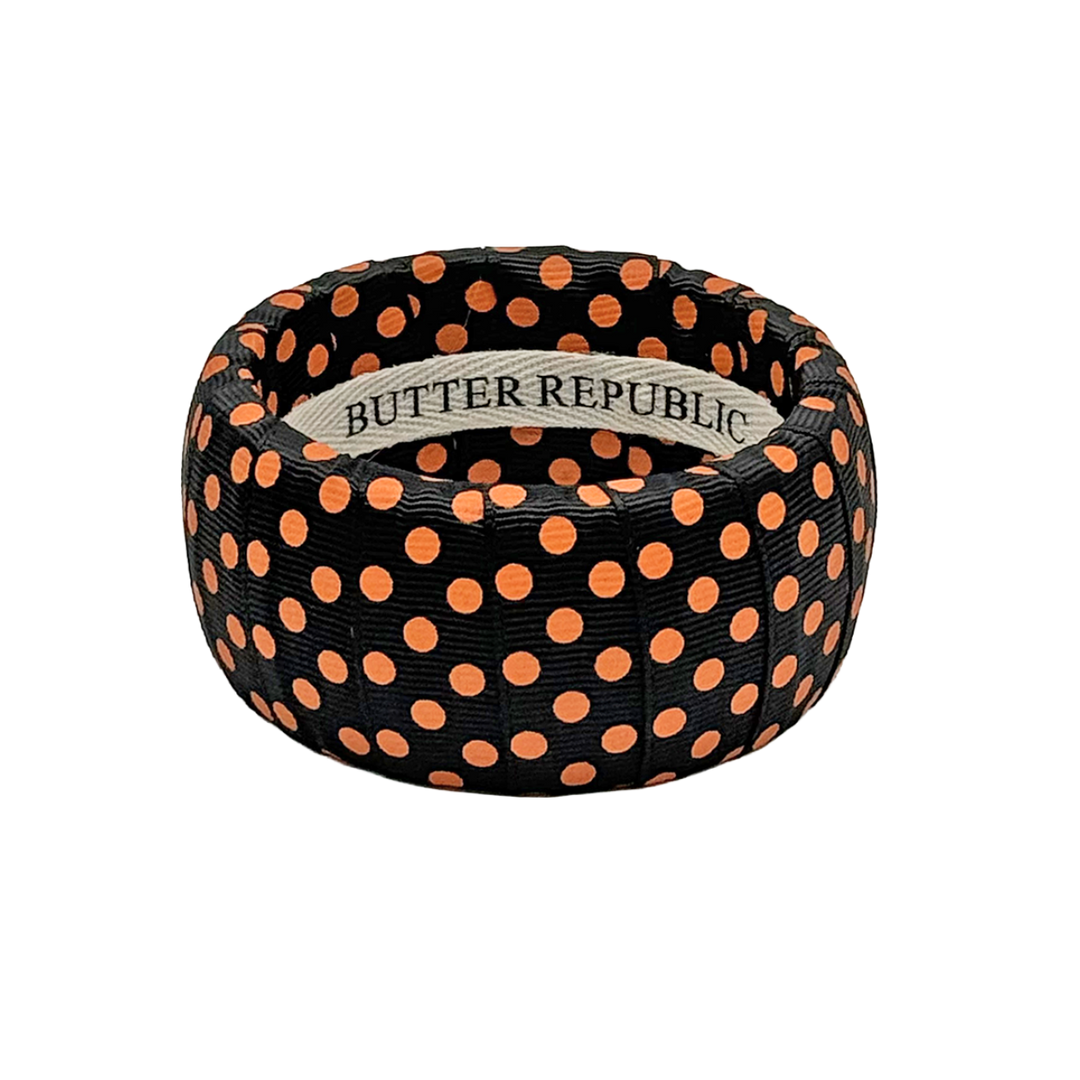 Black Butter Republic wide bangle bracelets with orange polka dots