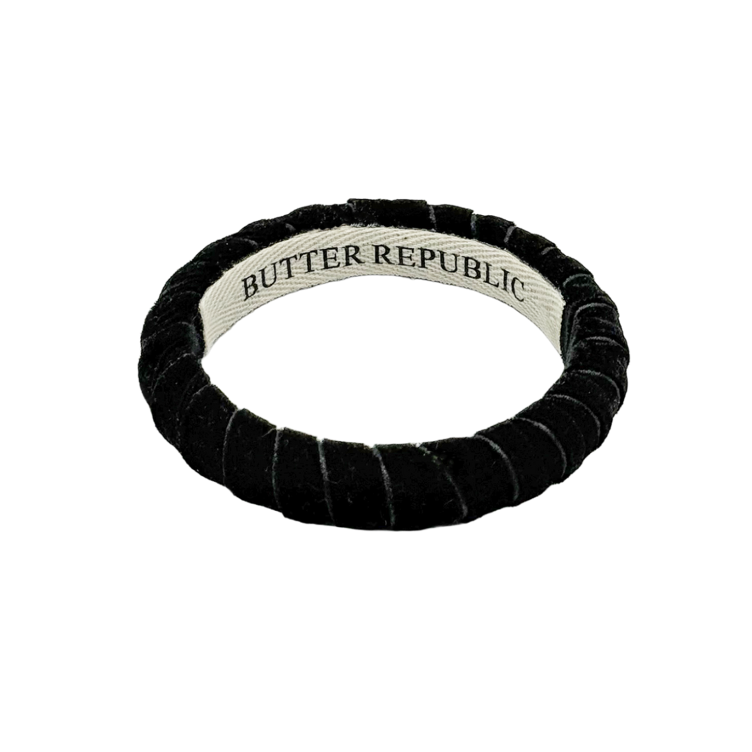 black velvet Butter Republic bracelet with logo brand label on the interior of the bracelet