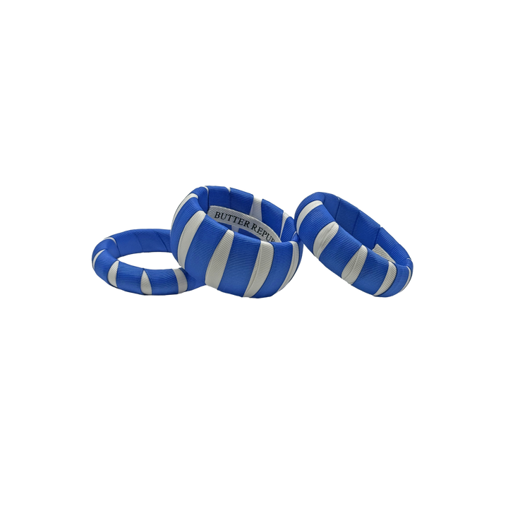 three multi-sized blue and white Butter Republic classic bracelets with logo brand label on the interior of the bracelet