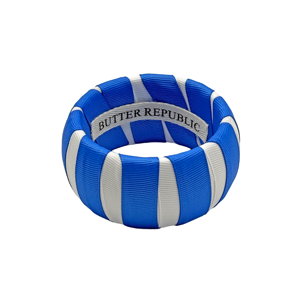 blue and white Butter Republic classic bracelet with logo brand label on the interior of the bracelet