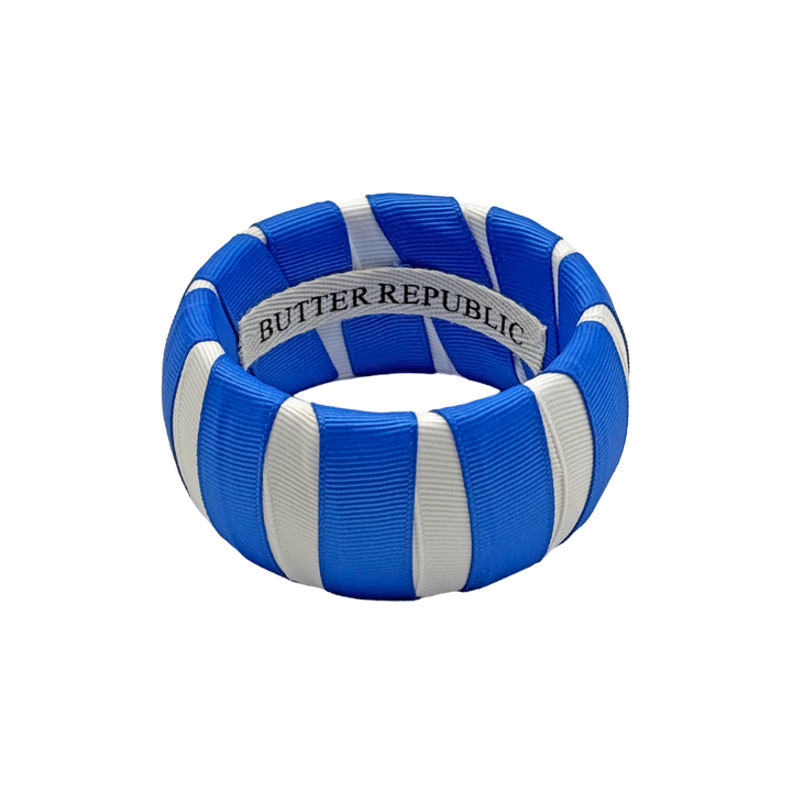 blue and white Butter Republic classic bracelet with logo brand label on the interior of the bracelet