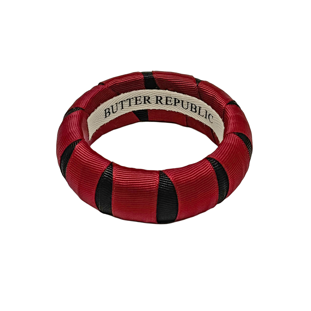 Garnet and black Butter Republic bangle bracelet with brand label on the interior