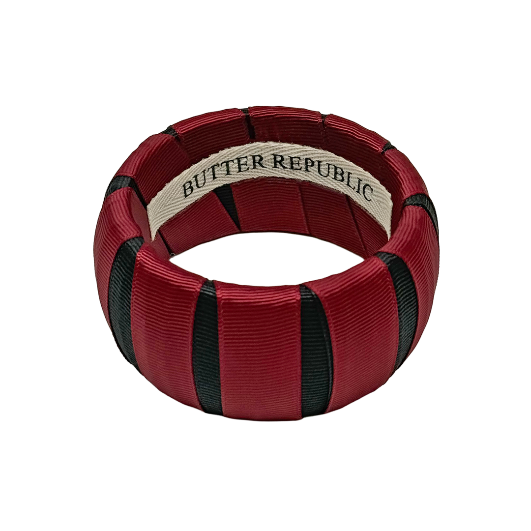 Garnet and black Butter Republic bracelet with brand label on the interior