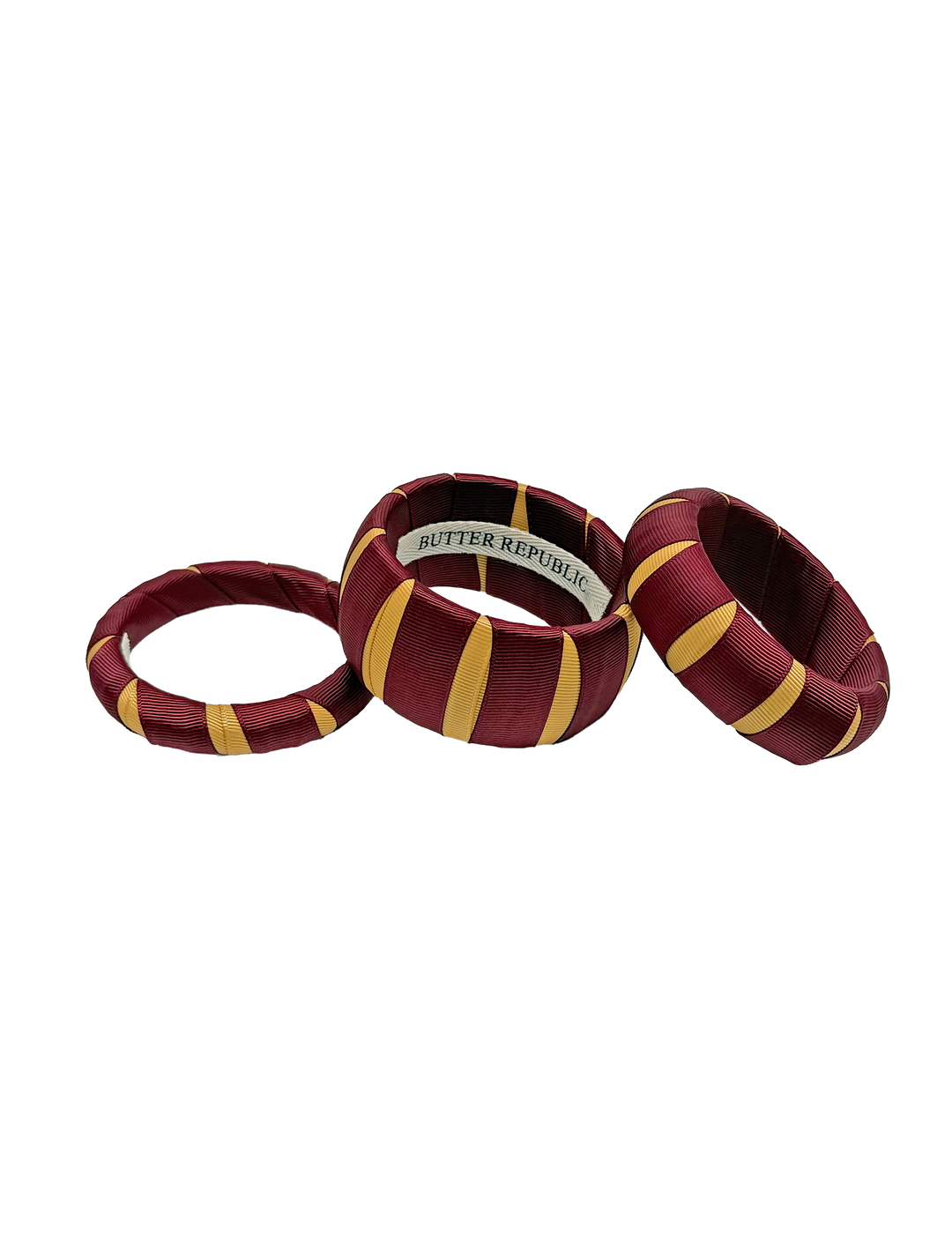 Three multi-width garnet and gold Butter Republic bracelets