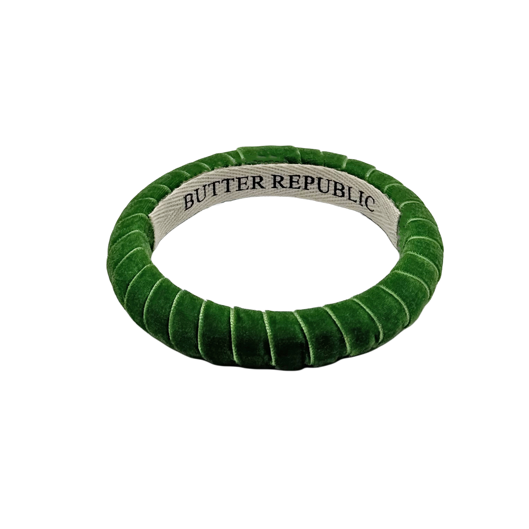 green velvet Butter Republic bracelet with logo brand label on the interior of the bracelet