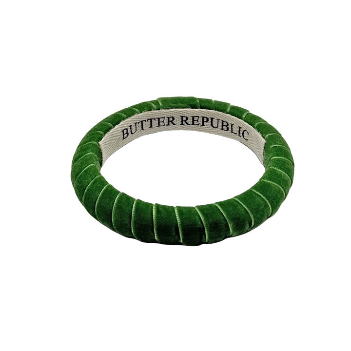 green velvet Butter Republic bracelet with logo brand label on the interior of the bracelet