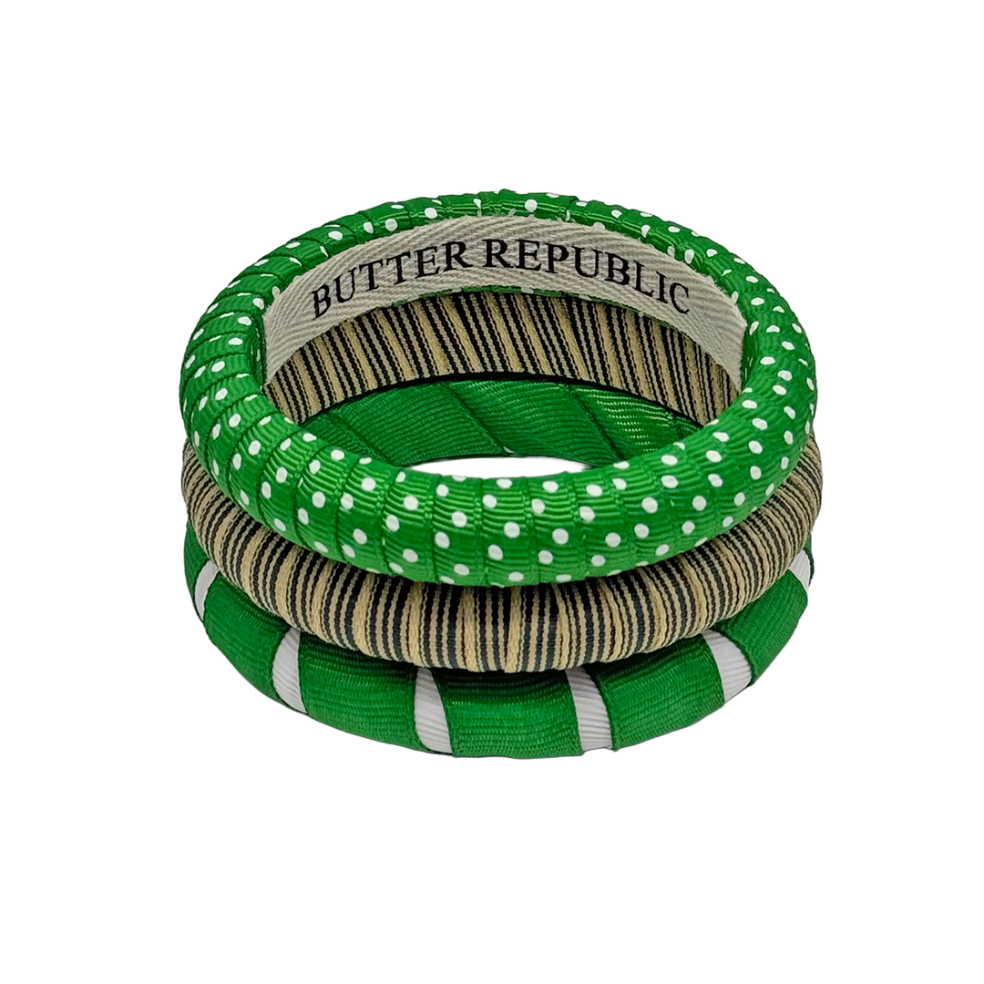 Three stacked green and white patterned bangles from Butter Republic 