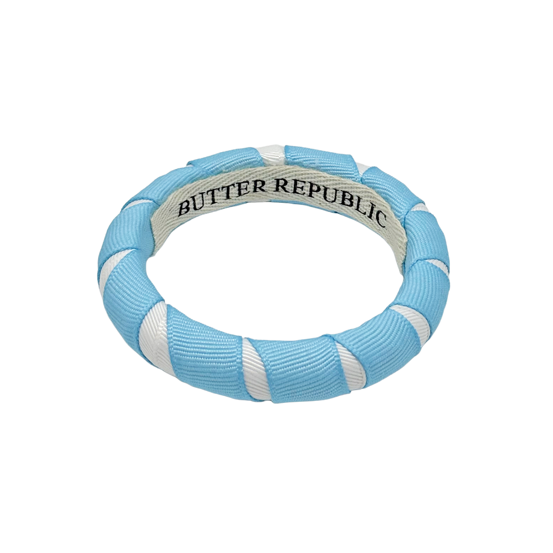Light blue and white Butter Republic bangle bracelet with brand label on the interior