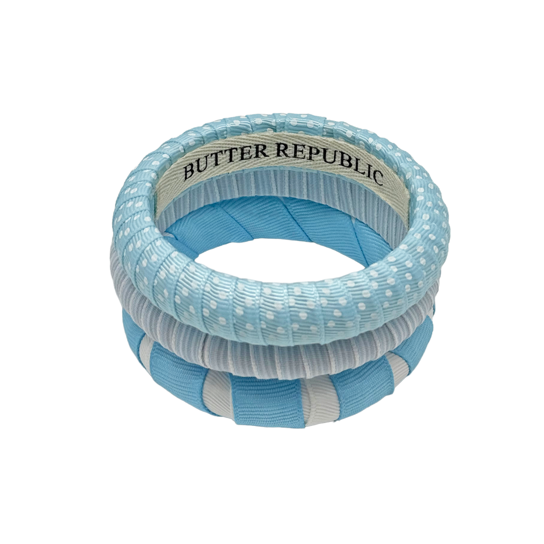Set of light blue and white patterned bangles Butter Republic bracelets with brand label on the interior