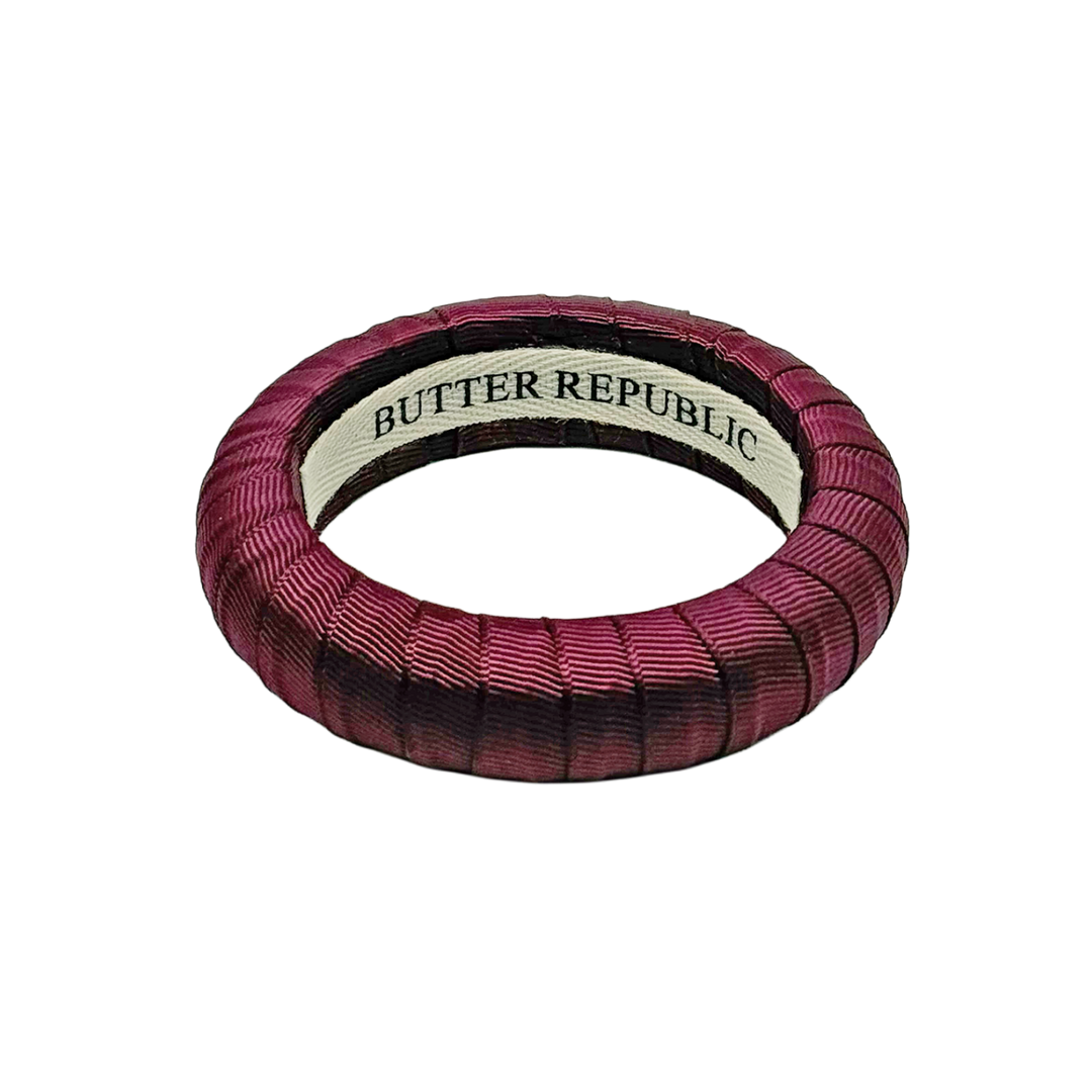 maroon medium Butter Republic bracelet with logo brand label on the interior of the bracelet