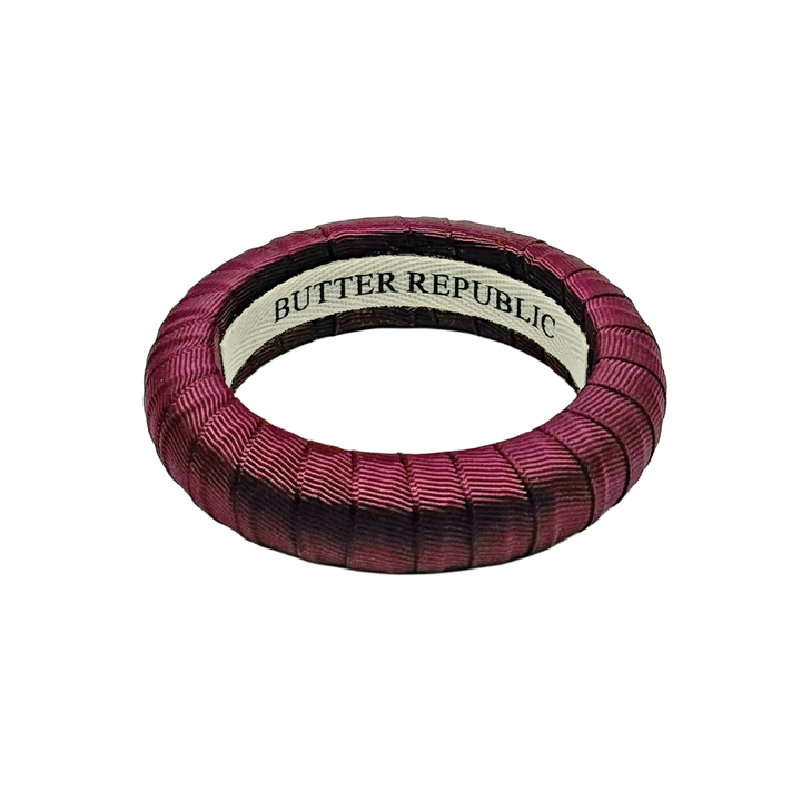 maroon medium Butter Republic bracelet with logo brand label on the interior of the bracelet