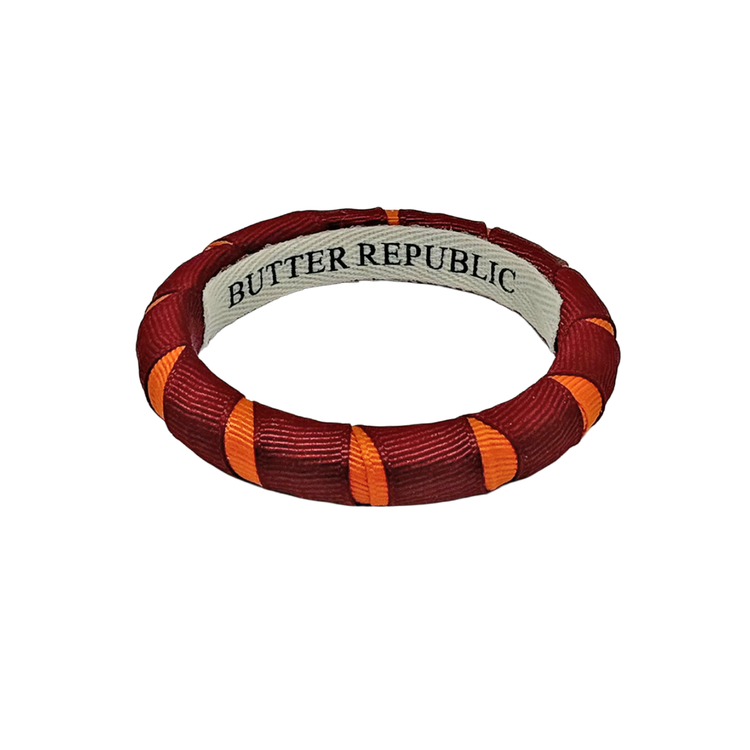 A maroon and orange Butter Republic bracelet