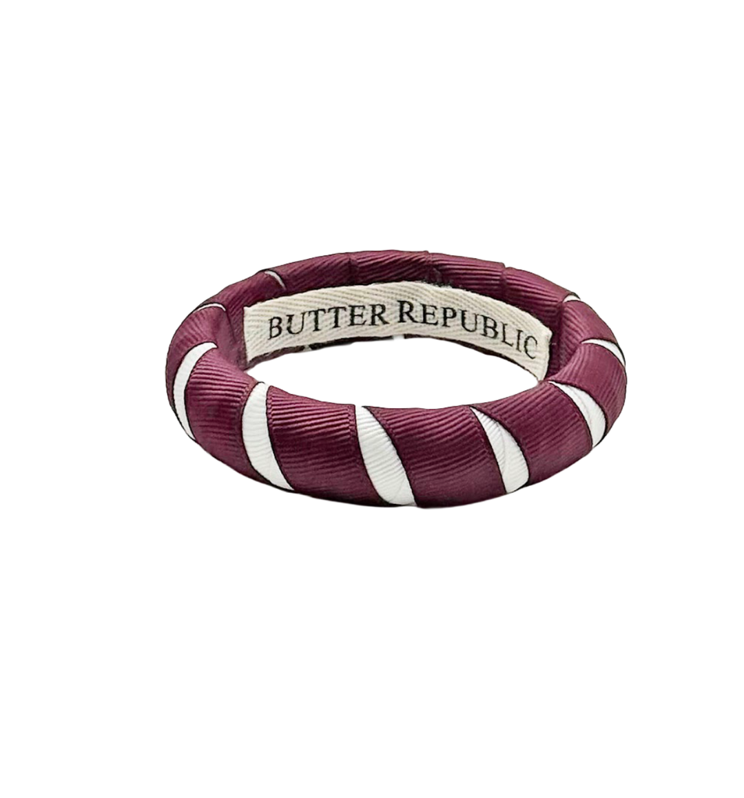 Maroon and white bracelet with 'Butter Republic' branding on the interior