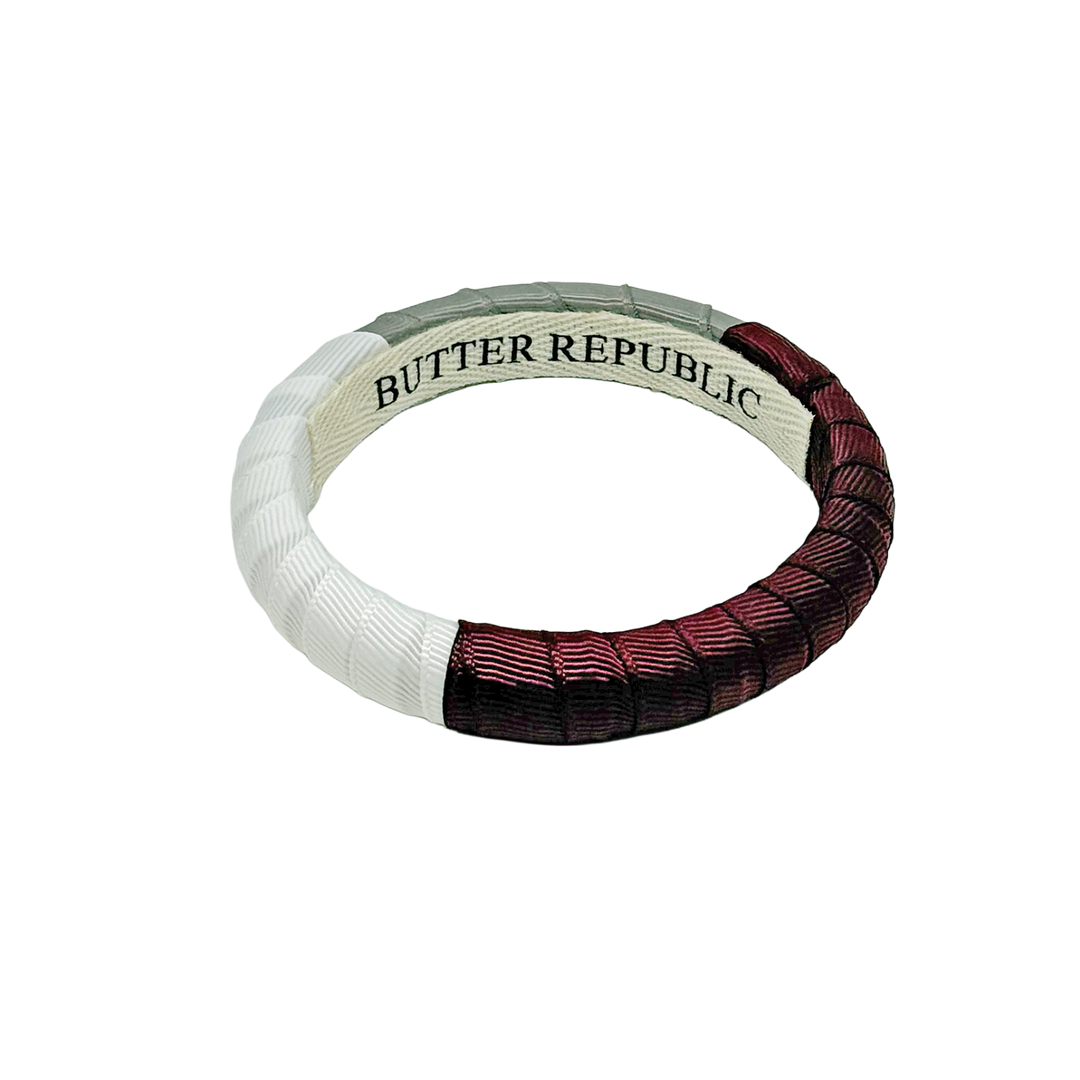 Maroon, white, and gray bracelet with Butter Republic branding on a white background