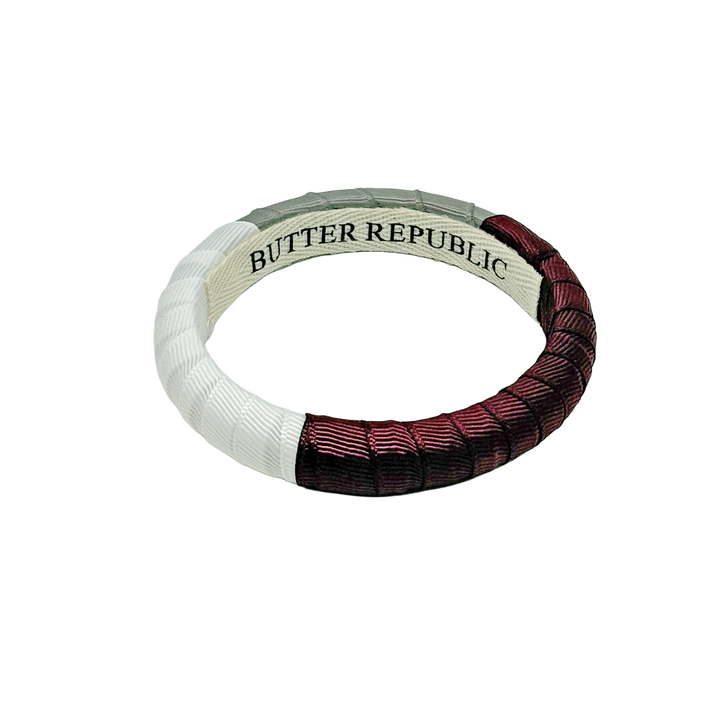 Maroon, white, and gray bracelet with Butter Republic branding on a white background