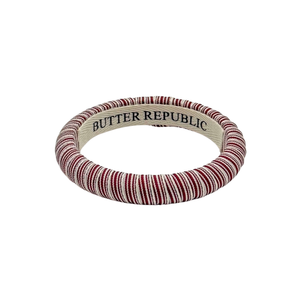 Maroon striped bracelet with 'Butter Republic' branding on the interior