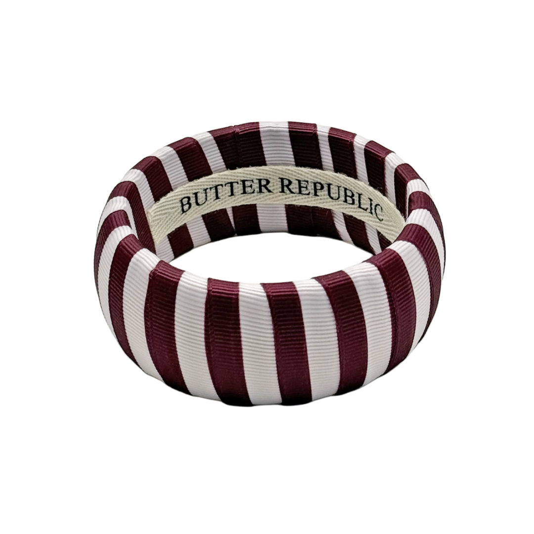 Maroon and white striped bracelet with 'Butter Republic' branding on the interior