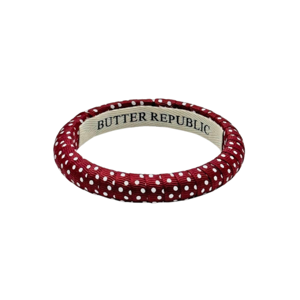 Maroon and white Swiss dot bangle bracelet with 'Butter Republic' branding on the interior