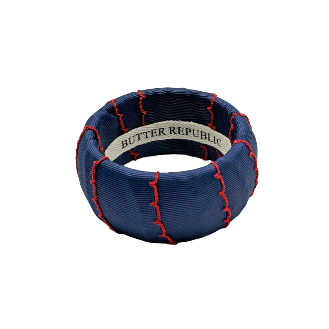 Navy blue ribbon with red stitching featuring 'Butter Republic' branding on the interior