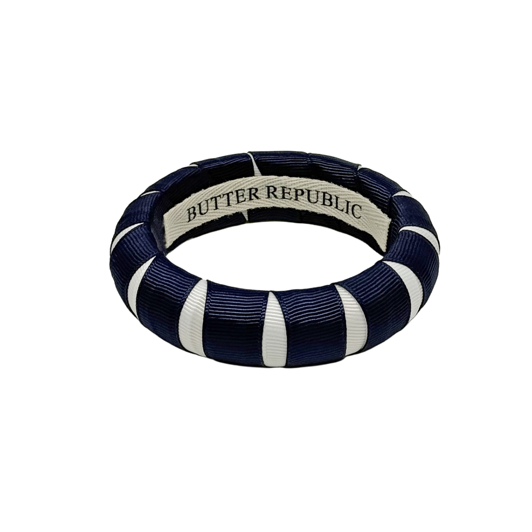 A navy blue and white Butter Republic bracelet