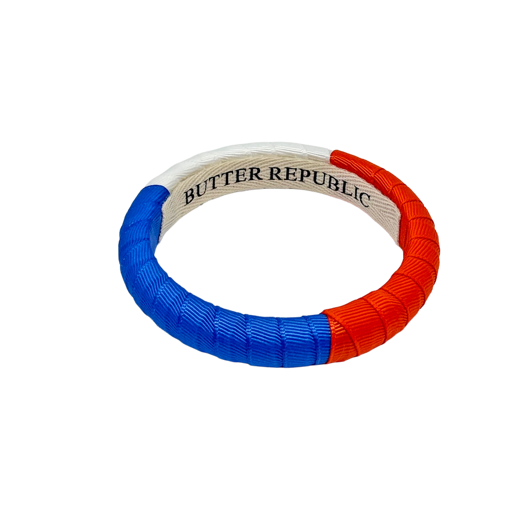 Colorful dog toy with Butter Republic brand label on the interior 
