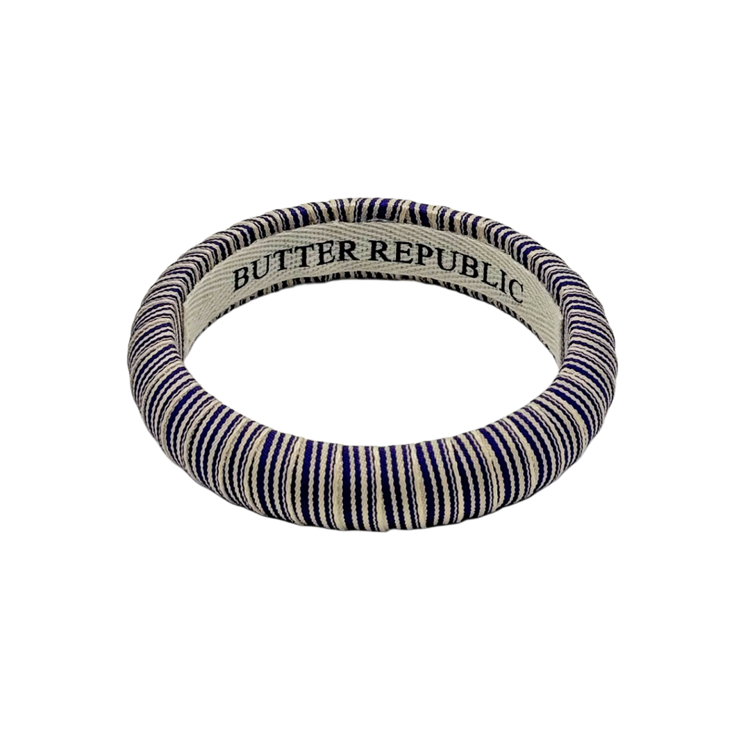 striped purple Butter Republic bracelet with a brand label on the interior of the bracelet