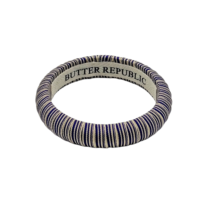 striped purple Butter Republic bracelet with a brand label on the interior of the bracelet