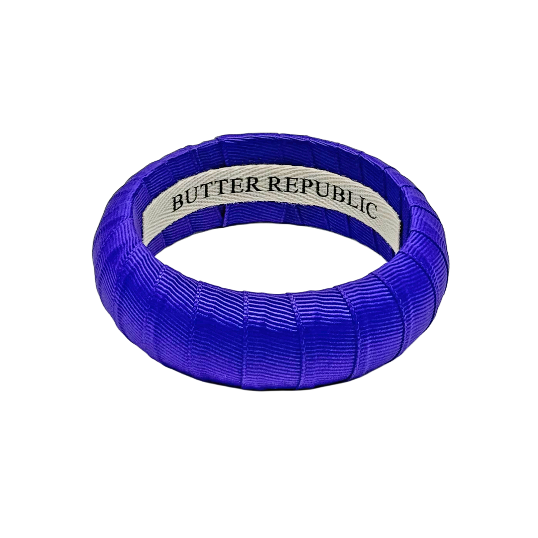 Purple hair Butter Republic bracelet with brand label on the interior