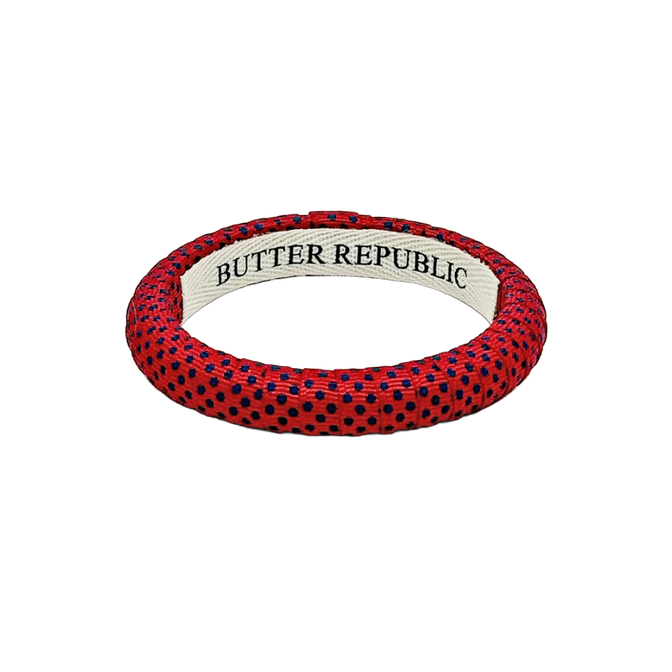 Red Butter Republic narrow bangle bracelet with blue Swiss polka dots