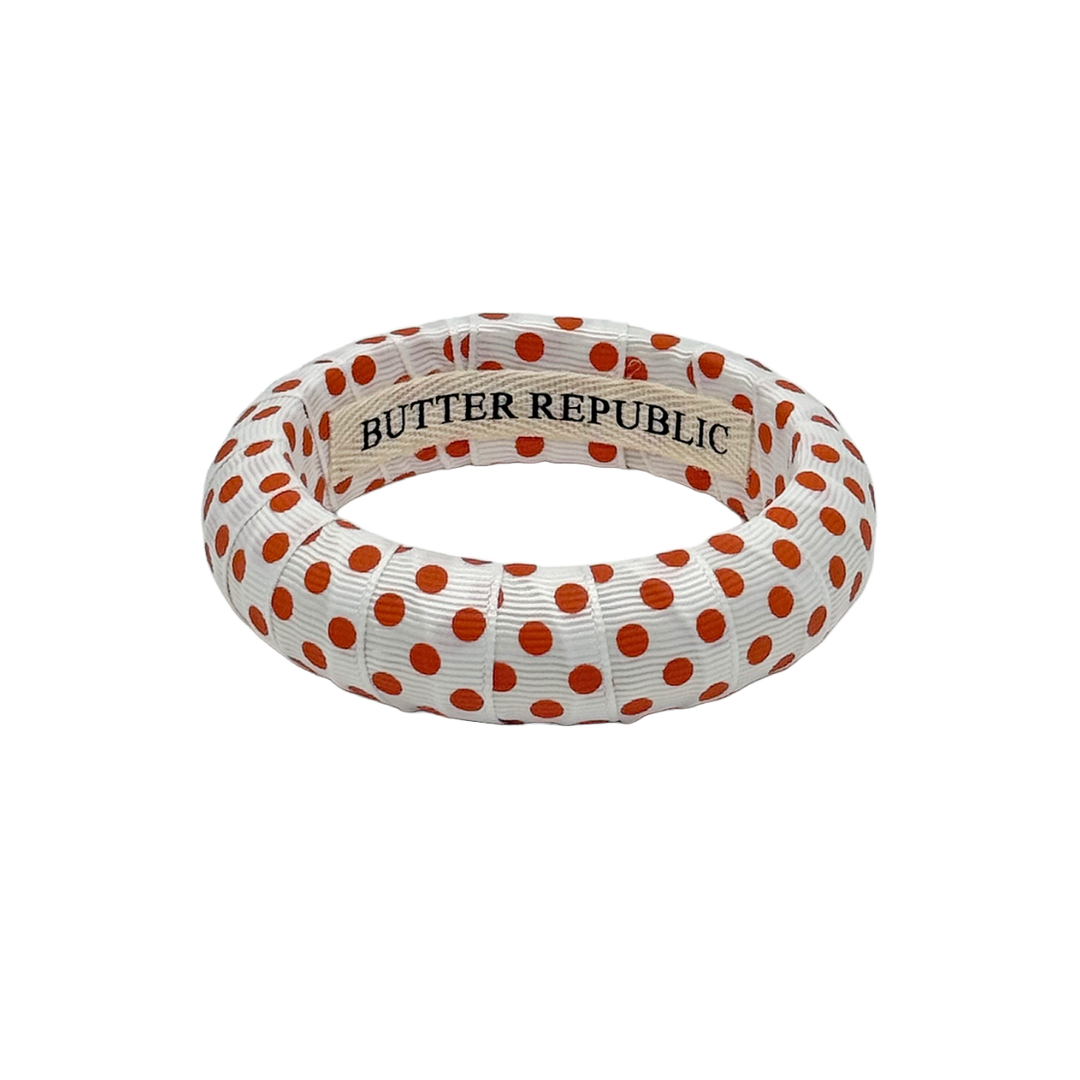 White Butter Republic bangle bracelet with small orange polka dots